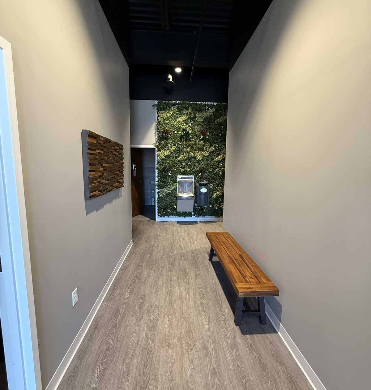 Modern hallway with bench and living plant wall